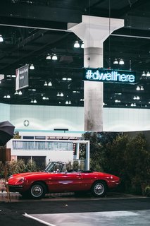Sitting in front of an enlarged photograph of a house in Venice from the June 2016 issue is a 1966 Alfa Romeo Duetto Spider provided by the Petrolicious Marketplace. Make sure to share your favorite moments from the show by using<span> <a href="/discover/dwellhere" target="_blank">#dwellhere</a></span>—we'll be doing the same. 
