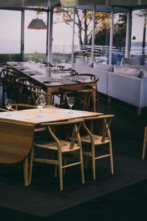 From the Twitter House that we featured in the November 2014 issue is a living/dining space that acts as the backdrop for one of the other vignettes. With furniture provided by Carl Hansen & Søn, the dining environment seems to blend right into the image. 