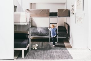 The bedroom contains a Kali Duo wall bed system from Resource Furniture and more carpet tiles from FLOR. It folds up into the wall and matches the bed in the image that was originally seen in the Schmidt-Friedlander Residence from the September 2014 issue. 