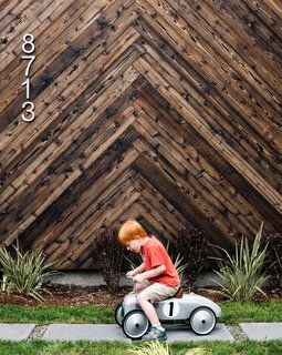 In Seattle’s Greenwood neighborhood, architect Tiffany Bowie built an efficient house for her father, Dave, a retired engineer. A prototype system by Kirio monitors the home’s energy use. Shou sugi ban cladding in a herringbone pattern provides a striking backdrop as Dave’s grandson Aksel zooms past.