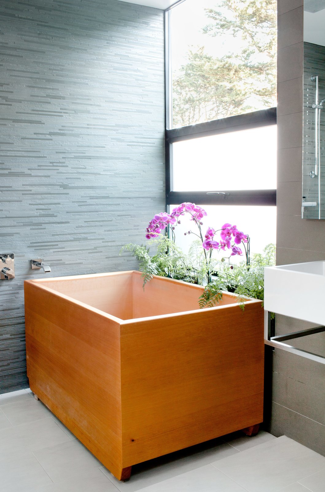 40 Modern Bathtubs That Soak In the View One such vacation inspired the tub, made of aromatic hinoki wood, in the master bathroom.