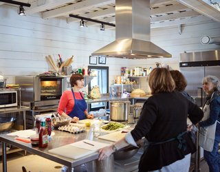 The Powisset barn’s state-of-the-art learning kitchen hosts public classes on everything from jam-making to food security. Its aged floors and ceilings are packed with cellulose insulation. 