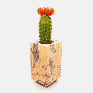 Traditional Sensibilities Made Modern with Raw Materials - Photo 4 of 6 - The object mixes resin and twigs together. 