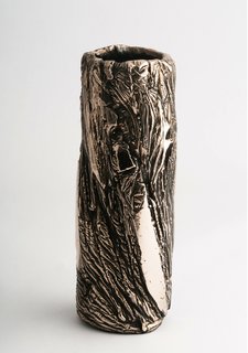 A slim bronze vessel. 