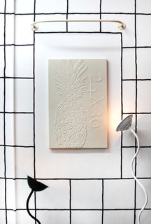 A wall-mounted piece by Michael Assiff with lighting by Elise <span style="line-height: 1.8;">Elise McMahon</span><span style="line-height: 1.8;">.</span>
