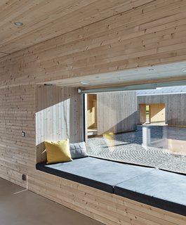 This Battery-Powered House Never Runs Out of Juice - Photo 6 of 7 - A window seat provides a place to relax post-sauna. 
