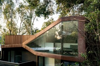 This Los Angeles Home is Driven by Automotive Design - Photo 1 of 9 - Resident Richard Kim, who works as the head of design at electric car company Faraday Future, tested his know-how with the creation of his own Los Angeles home, a curvilinear structure clad in Cor-Ten steel and black-stained cedar. "This house is different," says Richard. "It’s as much a sculpture as it is a place to live."