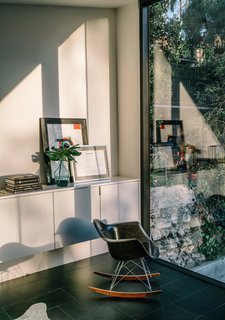 This Los Angeles Home is Driven by Automotive Design - Photo 8 of 9 - The home’s deep setback from the street means the couple can leave the large windows undressed to maximize light throughout the day.