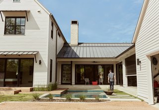 Automation Eliminates Tedious Chores for Dallas Homeowners - Photo 2 of 6 - Homeowners Matthew and Lindsay Thomas, who build houses for a living, worked with architects Todd Hamilton and Scott Slagle to create their own residence—a vernacular form characterized by horizontal clapboard cladding and a standing-seam, paint-grip roof.