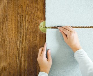 Installation of FLOR carpets is made simple with non-toxic adhesive dots that stick to the bottom of the carpet squares. The pieces only stick to each other, not the floor, so it's easy to remove, rearrange, and transport the rug.