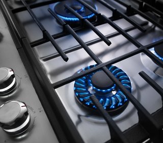 7 Kitchen Technologies to Watch - Photo 7 of 7 - The KitchenAid cooktop features a precise Torch Burner flame that makes it easy to adjust heat levels, from a small flame for simmering to a larger flame designed to distribute heat evenly. The surface is also coated in a finish that makes it a quick clean.
