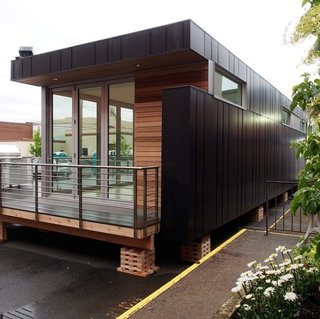 5 Things You Should Know About Modern Prefab Construction - Photo 1 of 5 - Prefab construction made it possible for the Monogram Modern Home to travel the country. Prefab housing is a notoriously flexible solution that treads lightly on the land. At 825 square feet, the Monogram Modern Home is easy to transport by truck. If a homeowner chose to use multiple units to form a larger house, they could break it apart and move them separately.