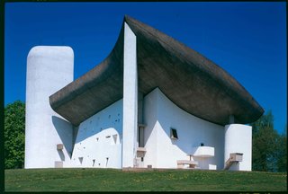 UNESCO Adds 17 Le Corbusier Buildings to Its Storied Ranks - Photo 1 of 8 - The sculptural Notre-Dame du Haut is unlike any other of the buildings by the architect. Built to replace a church after World War II, the modern chapel was designed to be a somber space that relies on the expressive form of the structure and use of nature light to create moments of reflection for visitors.