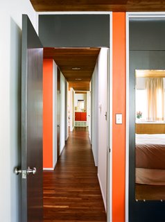 Kansas City Royal - Photo 4 of 15 - Cashmere flat paint by Sherwin-Williams was custom matched to the original chips provided by Breuer’s firm—dark gray for the wood doors and MB Red for accents.