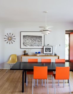 American Beauty - Photo 1 of 8 - Architect Chris Fein’s family home in Kansas is a showcase for modern design pieces, including a Le Corbusier LC6 dining table, chairs by Maarten Van Severen for Vitra, and a Louis Poulsen pendant. The sideboard is a Florence Knoll design from 1952, about the time the house was built. 