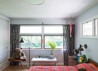 American Beauty - Photo 6 of 8 - The walls are painted in Borrowed Light by Farrow and Ball. His bed is a George Nelson design for Herman Miller. 