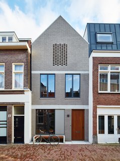 New Kid on the Block - Photo 1 of 10 - By setting an Amsterdam house a few feet back from the street, 31/44 Architects ensured the city’s planning department that the new construction would not block light to the surrounding structures. The gray brick facade references the building material of choice in the formerly industrial neighborhood, which has seen a residential resurgence.