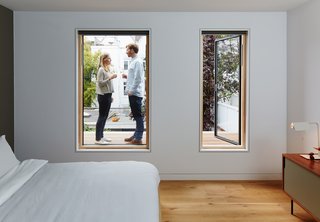 New Kid on the Block - Photo 7 of 10 - This helps tie the overall design of the house together," says Jeffries. The windows of the master bedroom—which features a Dann Sideboard by TemaHome—open to reveal a mahogany hardwood deck.
