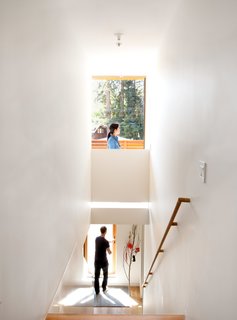 Check Back - Photo 8 of 14 - One of the more challenging aspects of the renovation, the staircase features a spine made of a single one-ton piece of powder-coated steel. 