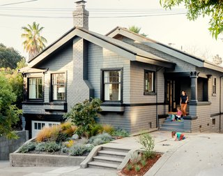 Check Back - Photo 13 of 14 - The 1912 Craftsman bungalow appears unchanged from the street, part of Cheng and Snyder’s strategy to maintain the neighborhood’s existing architectural character and appease local preservationists. A dark-gray finish from Glidden custom matches the home’s original color and contrasts with the bright interiors.