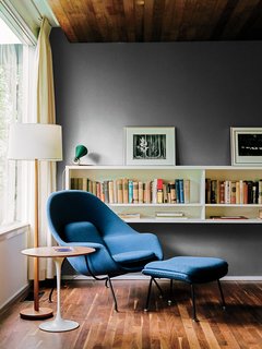 Kansas City Royal - Photo 10 of 15 - A walnut-topped table and Womb chair, both by Eero Saarinen for Knoll, offer a cozy spot for reading.