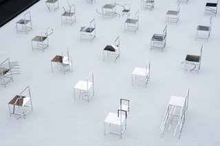 The installation is comprised of 50 stainless steel chairs. 