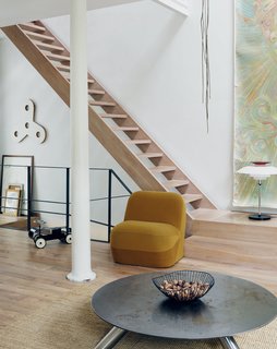 Venlet’s prototype of the armless Emperor’s Hat Chair sits near his Cuppa coffee table, made of Cor-Ten and stainless steel. 