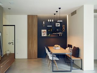 Sunset pendants by Treviso-based Torremato illuminate a custom table and bench as well as a trio of Eames chairs. Di Stefano and Bongiorno used lighting to structure the open plan: "We put accents on focus points; we didn’t want the light completely spread out," Di Stefano says.