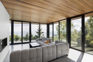 10 Gravity-Defying Cantilevered Homes - Photo 10 of 23 - Located on the second floor, the living room hovers above the lower deck.