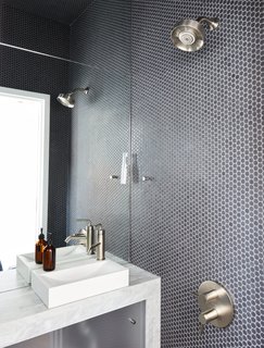 At His 350-Square-Foot Apartment, Small Space Champion Graham Hill Practices What He Preaches - Photo 10 of 15 - The wet bathroom, clad in Savoy penny tile by Ann Sacks, helped optimize the home’s petite footprint.