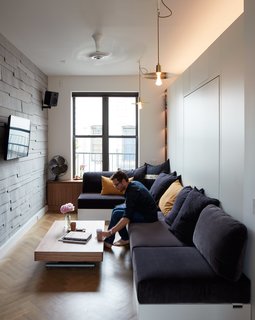 Small Space, Big Design - Photo 1 of 4 - Graham Hill, a sustainability advocate whose TED talks have delved into the benefits of living small, put his own lessons into practice at his 350-square-foot apartment, which he shares with his partner and two dogs. Quick transitions, like drawing the FilzFelt curtain, convert the living space into a bedroom. 