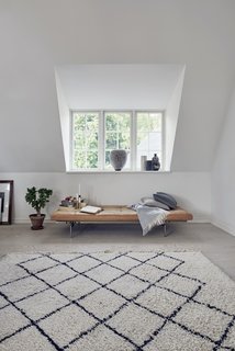 A Recent Trip Leaves Us Dwelling on Denmark - Photo 11 of 14 - A PK80 bench is opposite of the coffee table and sofa. 