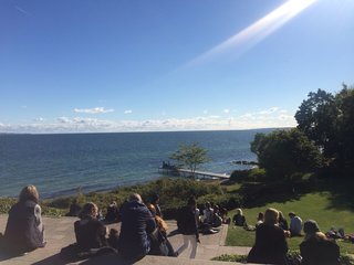 A Recent Trip Leaves Us Dwelling on Denmark - Photo 14 of 14 - Architect Jean Nouvel was commissioned by the museum to build a dock in 2005. Visitors sit at the edge of a hill to enjoy views of the water. 