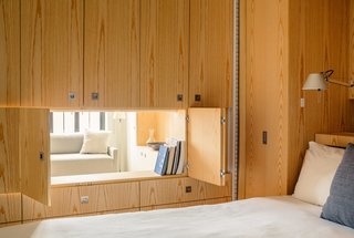 After successfully reconfiguring his own tiny New York City apartment, Robert Garneau, partner at Architecture Workshop PC, reinvented a 400-square-foot studio for neighbors just a few floors down. Called the Pivot Apartment, the highly efficient residence now serves multiple functions, thanks to a central modular unit that can be arranged to create distinct stations for living, sleeping, and entertaining.