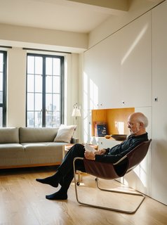 Resident Paul Andersson lounges in a Paulistano armchair by Paulo Mendes da Rocha.