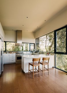 In the living room and kitchen, soft-but-tough Expanko cork flooring provides comfort and stands up to dings and scuffs. While the kitchen was designed primarily with Surendra and a caregiver’s needs in mind, it also accommodates the five-foot-radius of a wheelchair. 