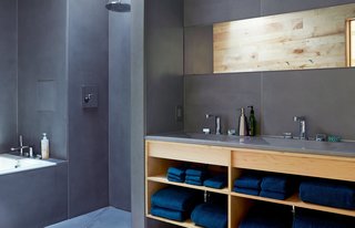 Happy Trails - Photo 5 of 7 - HardLife Products manufactured the bathroom’s custom concrete walls, floor slabs, and sink basins, which are paired with faucets by American Standard. 
