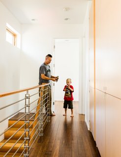 On the upstairs landing, Chris and Ben pause by an IC Railings system from Issaquah Cedar and Lumber.