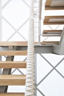 Such Great Heights - Photo 1 of 13 - Designer and prefab proponent Jennifer Siegal’s home is a site of continual experimentation. To create the custom leather-and-rope-wrapped handrail on the new staircase, she collaborated with Nicole Blue and Gabriela Schweizer, interns at her Office of Mobile Design.