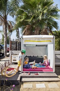 Such Great Heights - Photo 4 of 13 - . Daughter Sydney plays with friends in Siegal’s prototype for a prefab playhouse.