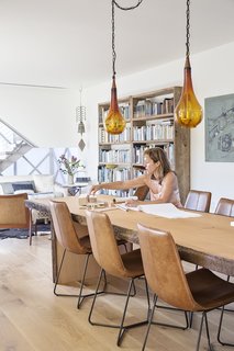 8 Dwell Projects That Were Proudly Designed by Women - Photo 2 of 8 - Siegal sits at a table made by Granada Millwork. The chairs are from West Elm and the pendants are from Patrick Braden.