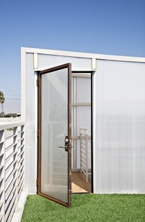 Such Great Heights - Photo 9 of 13 - Carpeted with artificial turf salvaged from the Santa Monica Airport, the rooftop deck is a green getaway.