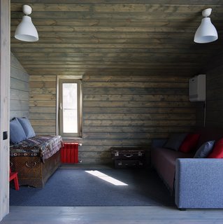 DublDoms are designed so that they can be integrated into many different settings—houses have been shipped as far away as Italy and France. Though they are standardized, it’s the interiors and "energy" that make each one unique, Ovchinnikov says. Anna envisioned her house as a pastoral contrast to her hectic urban life. In a guest room, an IKEA sleeper sofa sits opposite an antique chest.