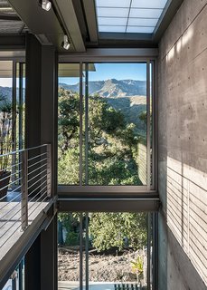 From the Ashes - Photo 2 of 4 - A steel-and-glass stairway keeps things open. Structural steel contractor Russ Jones was a key player. "Wood is easily manipulated on site; you can push and shove it," Hector says. "Steel is different. It requires a steel erection team." Image by Hector Magnus.