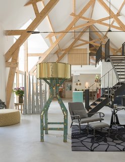 The lamp in the foreground is from Joost's Mechanic Constructions series, which shows pieces made from hand-cut elements that have been bolted together. 