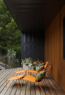 Together with Nick Dine, Chris also designed the concrete planters, pillows, and powder-coated steel lounge chairs on the front deck; all are part of the Modern by Dwell Magazine home collection for Target. Predominantly native, fire-resistant plantings dot the property, which sits in a wildland urban inter-face (WUI) zone. 
