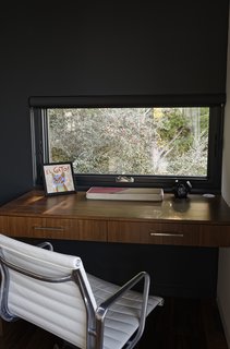 Chris designed a custom built-in desk in the den for Ellen, who often works from home. 