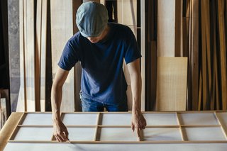 How to Shape a Shoji, Step by Step - Photo 8 of 8 - The addition of the rice paper, carefully slid into the inner channel of the assembled piece, completes the screen. The whole process takes a week on average.