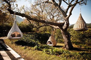10 Surreal Tree Houses That Will Make Your Childhood Dreams Come True - Photo 2 of 10 - Dedon’s Hanging Lounger, designed by Daniel Pouzet and Fred Frety can be an instant mini-tree house escape. All you need is the right tree to hang it from. 