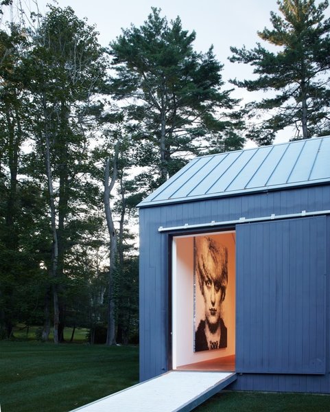 Take a peek into the edge of the 19th-century barn that Ferris transformed into a gallery. The traditional barn structure was retained while the interior was turned into a minimal and open canvas for the current homeowner’s art collection. It’ll be interesting to see how the next owner utilizes the space. Photo 6 of Wiley House modern home